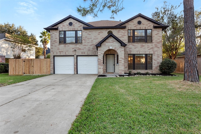 view of front of home featuring a front yard and a garage