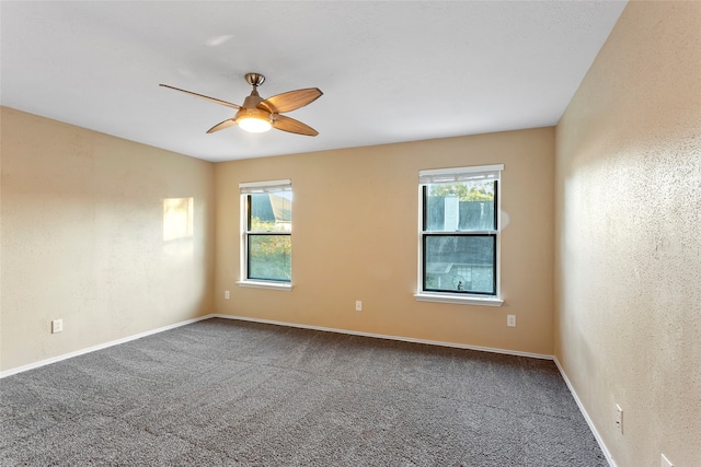 empty room with carpet and ceiling fan