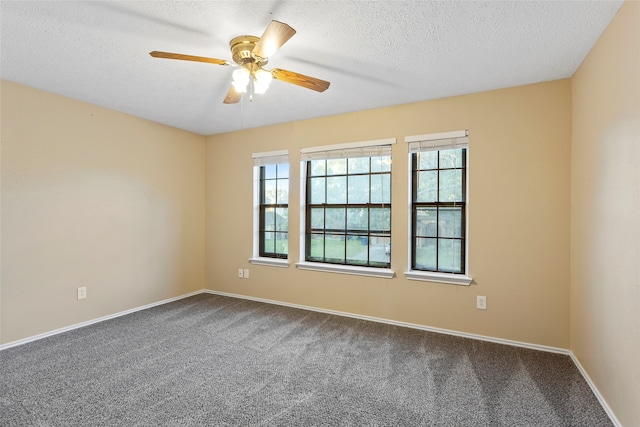 carpeted empty room featuring a textured ceiling and ceiling fan