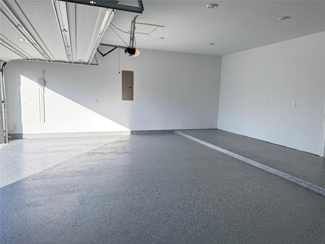 garage featuring electric panel and a garage door opener