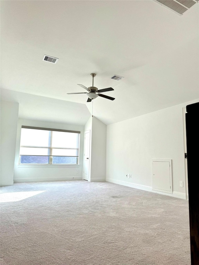 unfurnished room featuring lofted ceiling, visible vents, and a ceiling fan