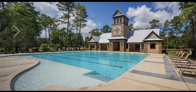 view of pool featuring a patio area