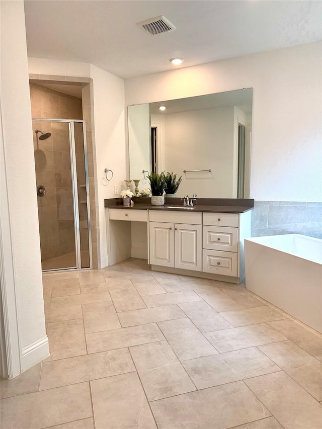 full bath with a washtub, visible vents, a shower stall, and vanity