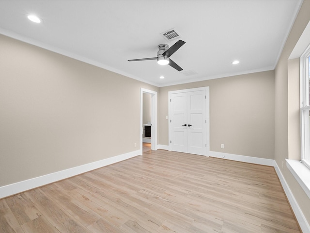 unfurnished bedroom with a closet, ceiling fan, light hardwood / wood-style flooring, and ornamental molding