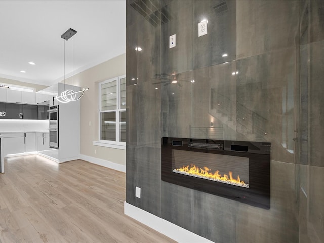 interior space with stainless steel double oven and wood-type flooring