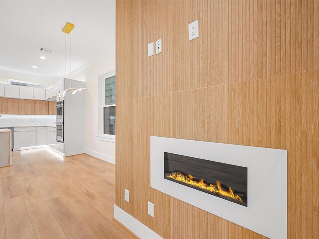 unfurnished living room with light hardwood / wood-style floors