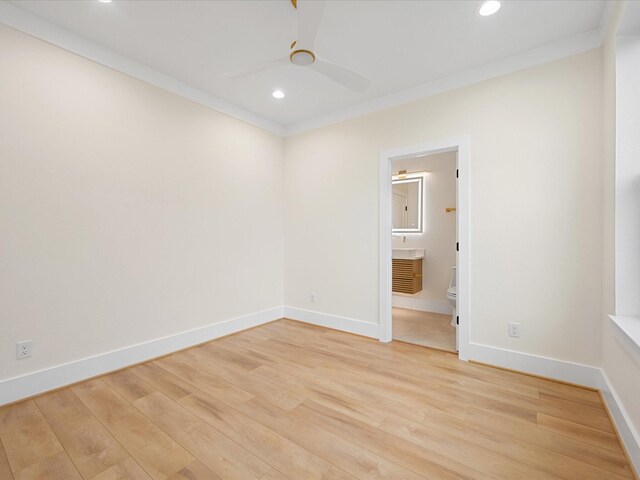 unfurnished room with light hardwood / wood-style floors, ceiling fan, and ornamental molding