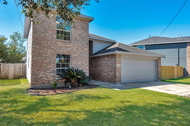 view of front of property featuring a front yard and a garage