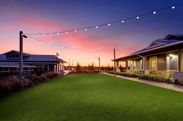 view of yard at dusk