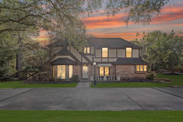 view of front of property with a lawn