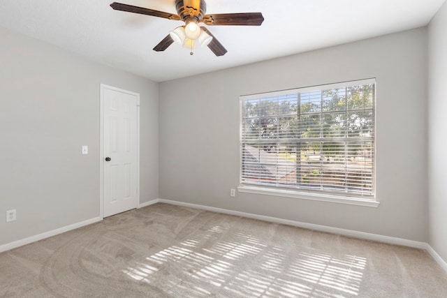 empty room with light carpet and ceiling fan