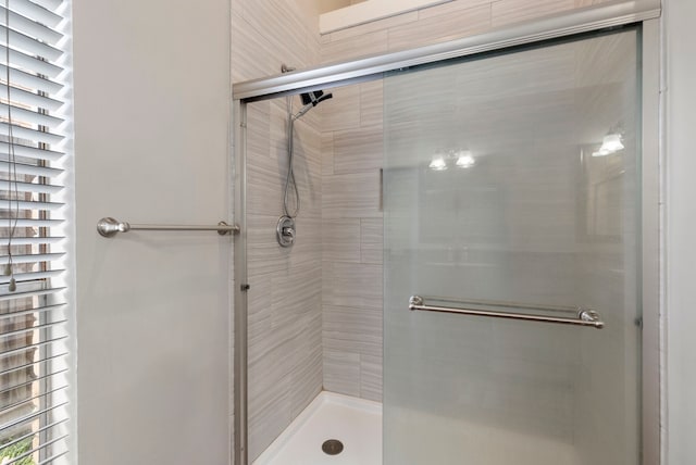 bathroom featuring an enclosed shower