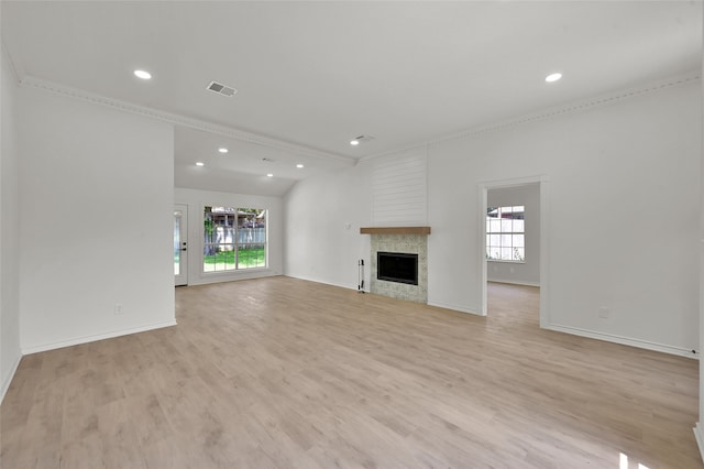 unfurnished living room with light hardwood / wood-style flooring and plenty of natural light