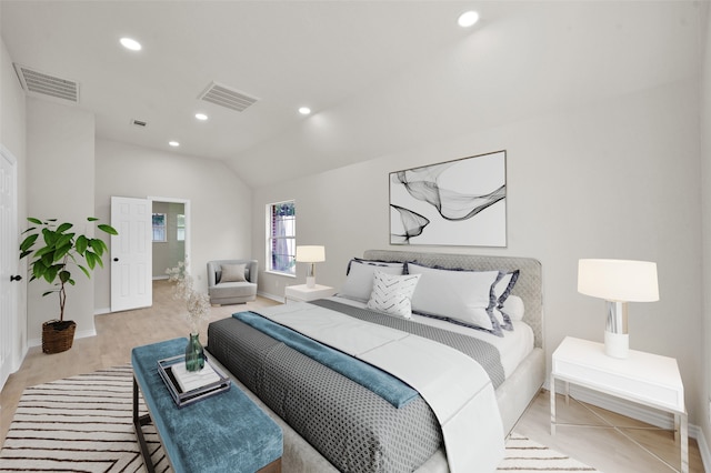 bedroom featuring vaulted ceiling and light hardwood / wood-style flooring