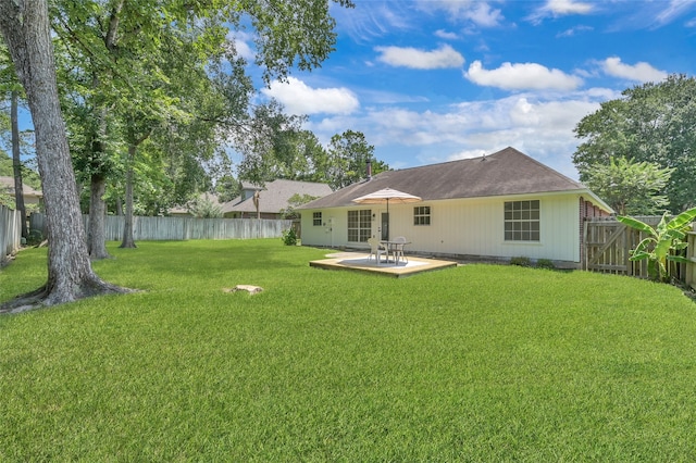 back of property featuring a patio and a lawn