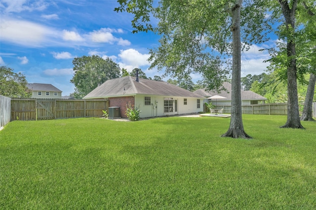 view of yard with a patio and central AC