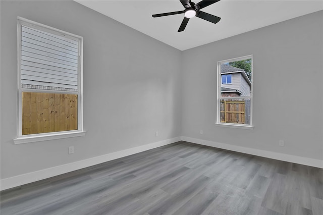 unfurnished room with ceiling fan and wood-type flooring