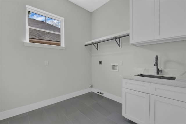 clothes washing area featuring cabinets, hookup for an electric dryer, sink, and hookup for a washing machine