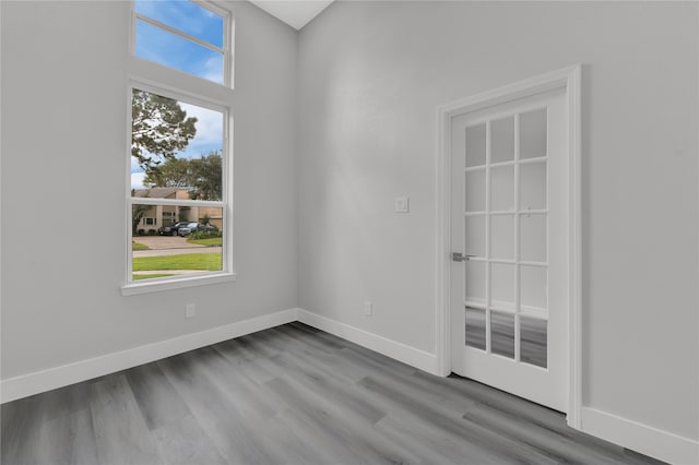 unfurnished room with light wood-type flooring