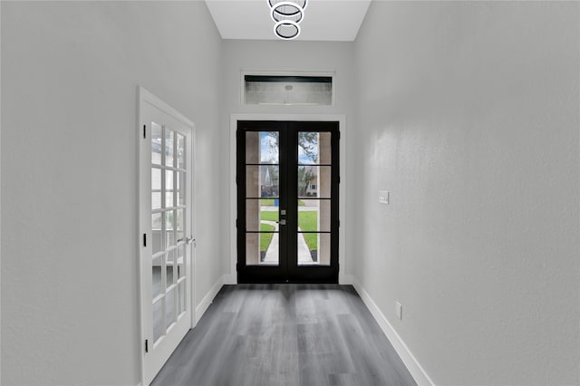 doorway to outside with a wealth of natural light, french doors, and hardwood / wood-style flooring