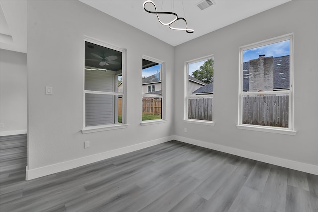 empty room with hardwood / wood-style floors