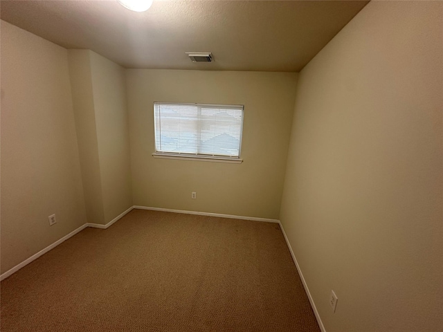 unfurnished room with carpet flooring