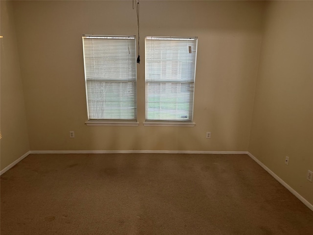 empty room with carpet flooring