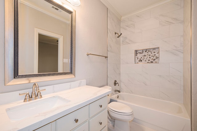 full bathroom featuring toilet, crown molding, tiled shower / bath combo, and vanity