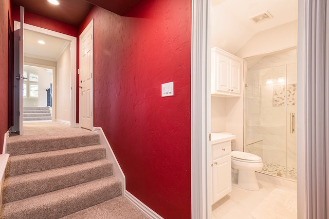 stairs featuring ornamental molding, carpet floors, and lofted ceiling