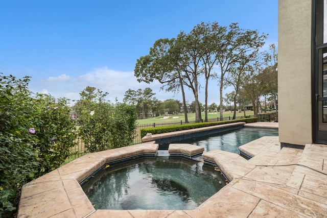 view of pool featuring an in ground hot tub and a patio