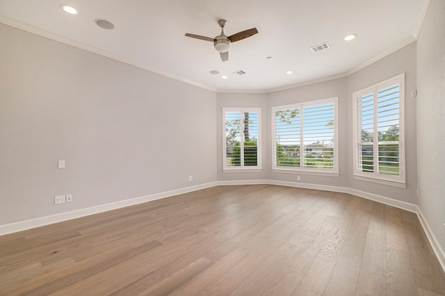 spare room with light hardwood / wood-style flooring, ornamental molding, and ceiling fan