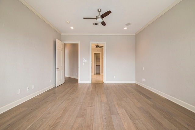 spare room with light hardwood / wood-style floors, crown molding, and ceiling fan