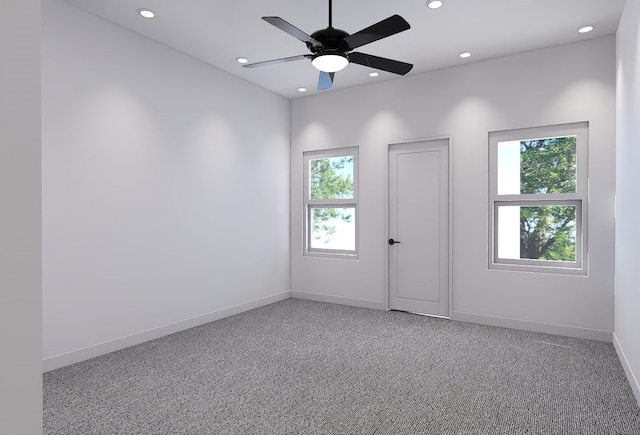 spare room featuring carpet and ceiling fan