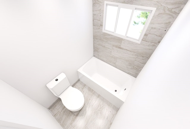 bathroom with a bathtub and toilet