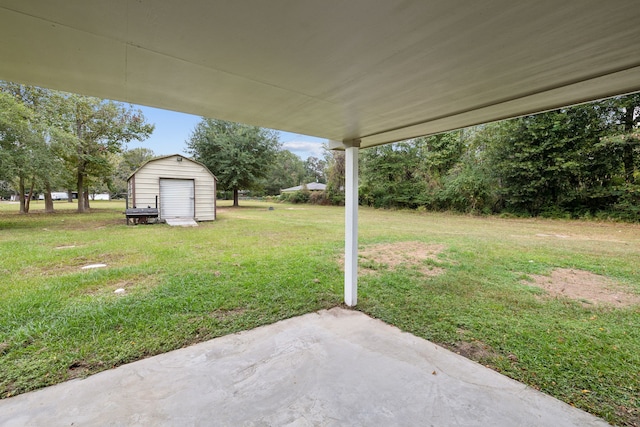 view of yard with a patio and a shed