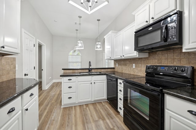 kitchen with black appliances, white cabinets, sink, hanging light fixtures, and light wood-type flooring