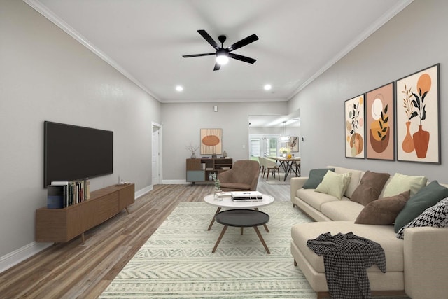 living room featuring ceiling fan, wood-type flooring, and crown molding