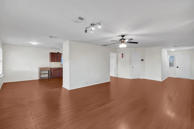 unfurnished room with hardwood / wood-style flooring and ceiling fan