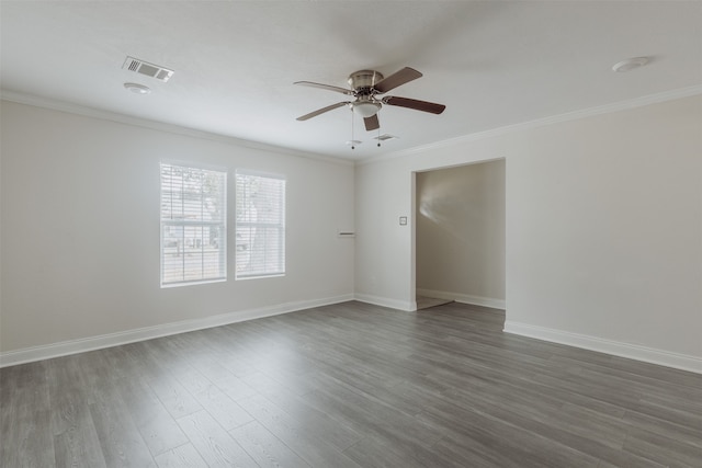 empty room with dark wood-type flooring, ceiling fan, and crown molding