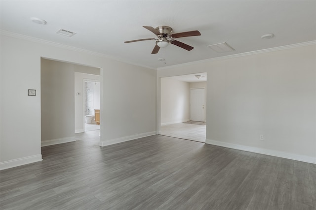 unfurnished room with hardwood / wood-style floors, ceiling fan, and crown molding