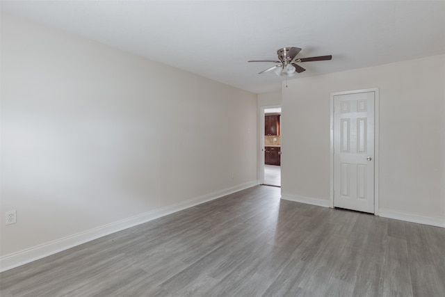 unfurnished room with light hardwood / wood-style floors and ceiling fan