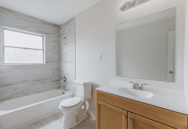 full bathroom with vanity, toilet, and tiled shower / bath combo