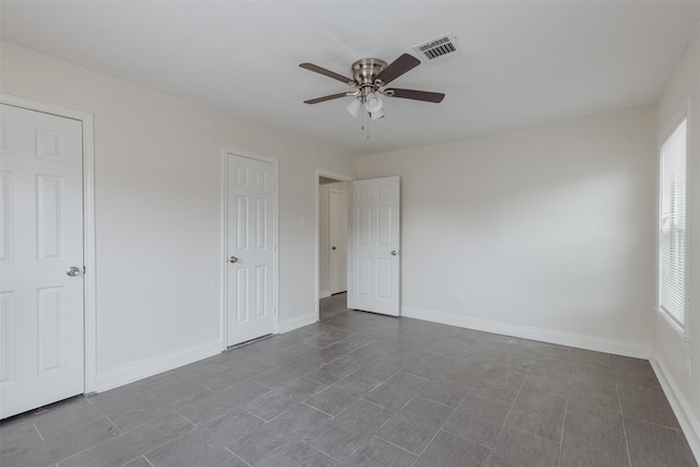 unfurnished bedroom featuring ceiling fan