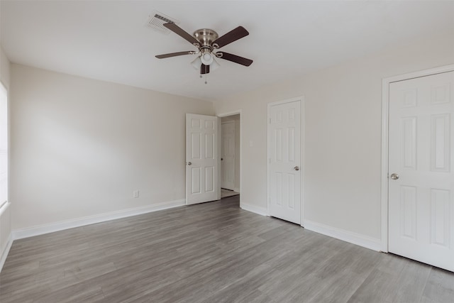 unfurnished bedroom featuring light hardwood / wood-style flooring and ceiling fan