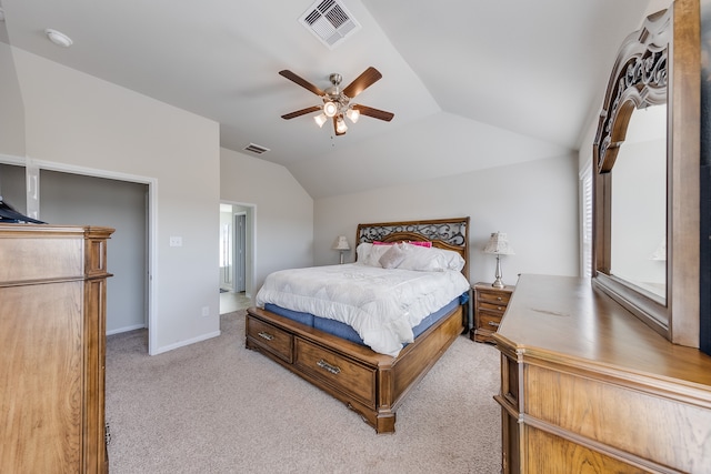 carpeted bedroom with ceiling fan and vaulted ceiling