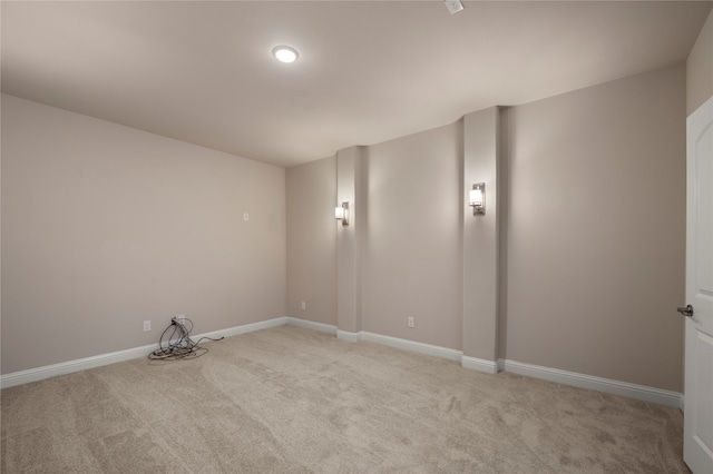 spare room with light carpet