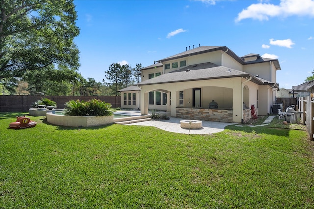 back of property featuring a patio area, stucco siding, and stone siding