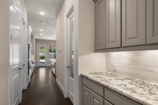 hallway with dark wood-type flooring