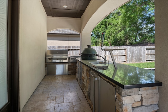 view of patio / terrace featuring area for grilling and sink