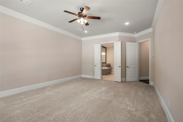 unfurnished bedroom featuring ensuite bath, ceiling fan, crown molding, and light carpet